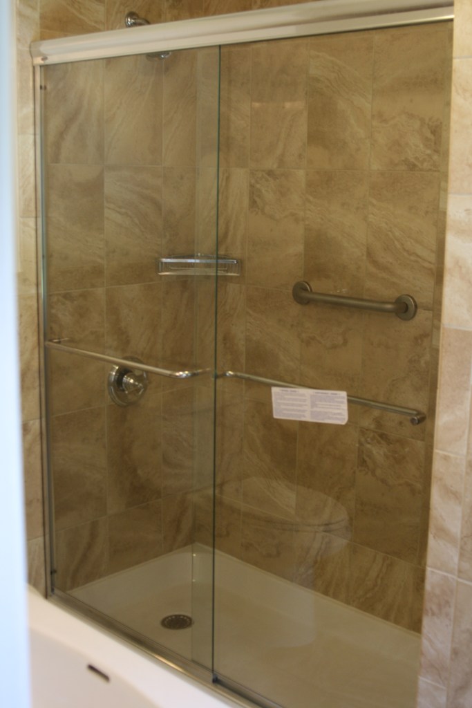 Shower surround with glass door