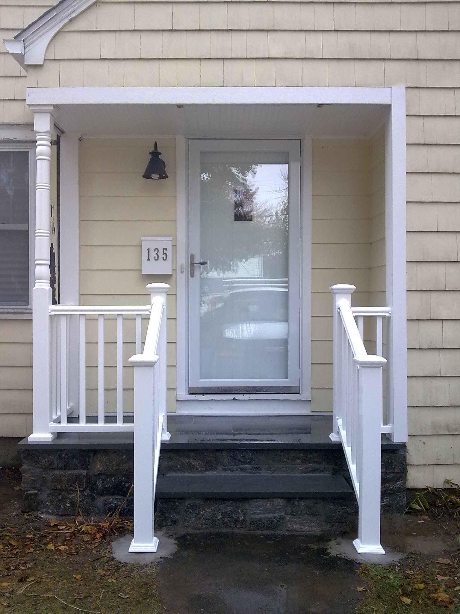 Front entrance porch over blue and field fascia stones