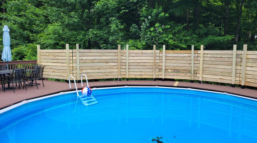 Pool fence over existing pool deck.